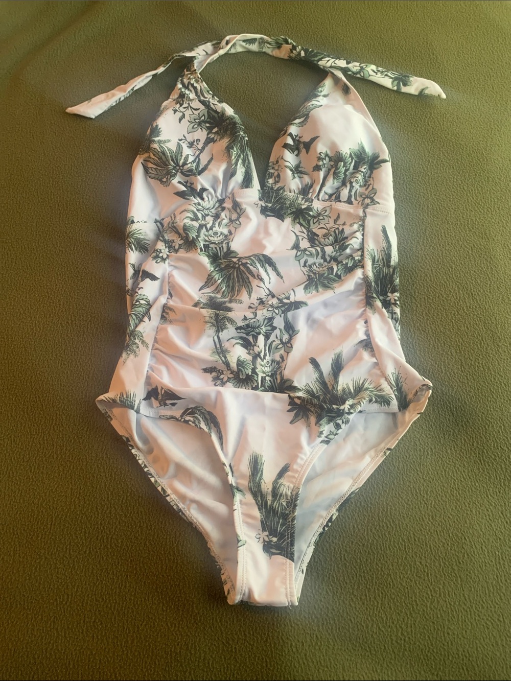 NWOT SHEIN white with green floral pattern halter swimsuit. Size Large.